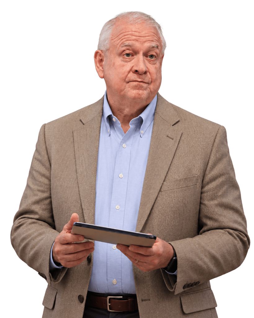Gary L. Froseth holding a tablet while speaking.